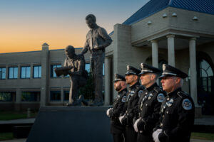 Honor Guard 2024 -photoshoot. Members of the Honor Guard standing in front of the Fallen Officers Memorial which is located outside the Huntsville Public Safety Complex on Wheeler Avenue.